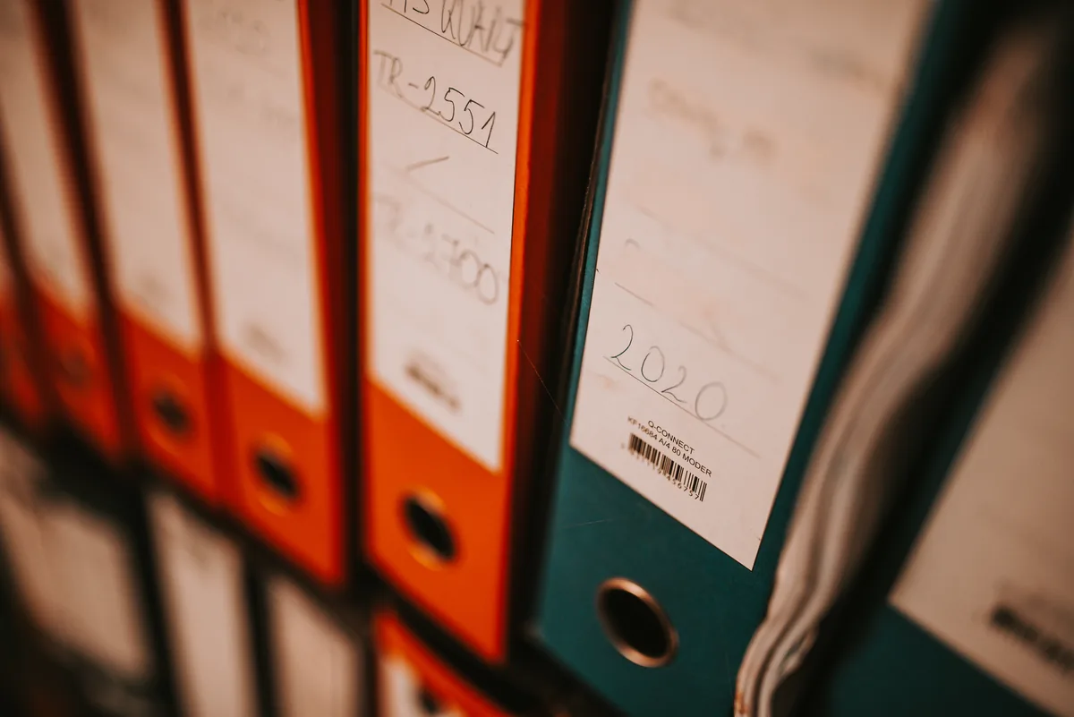 A shelf of labelled binders